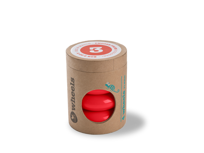 red wheels in cardboard tube